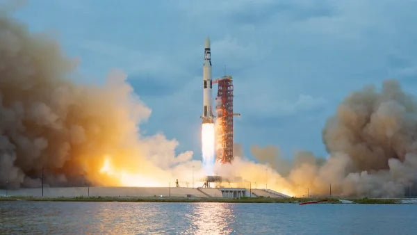 NASA rocket launch from Michoud Assembly Facility connection in New Orleans showing Saturn and Space Launch System production for Moon missions