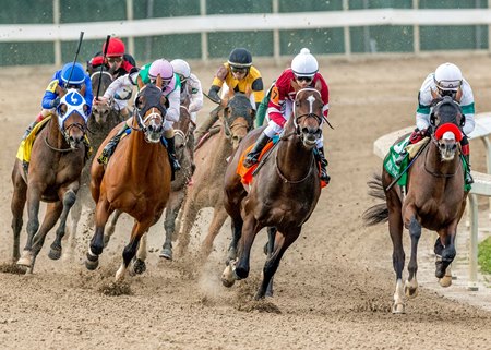 thoroughbred horse race with jockeys competing on dirt track representing New Orleans horse racing tradition and derby culture