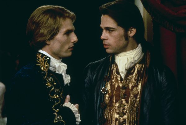 Scene from Interview with the Vampire featuring characters in period costumes set in historic New Orleans showcasing gothic atmosphere