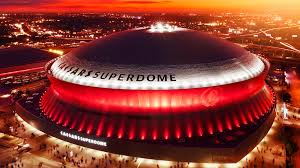 Caesars Superdome in New Orleans illuminated at night iconic stadium that has hosted multiple Super Bowl games and major NFL events